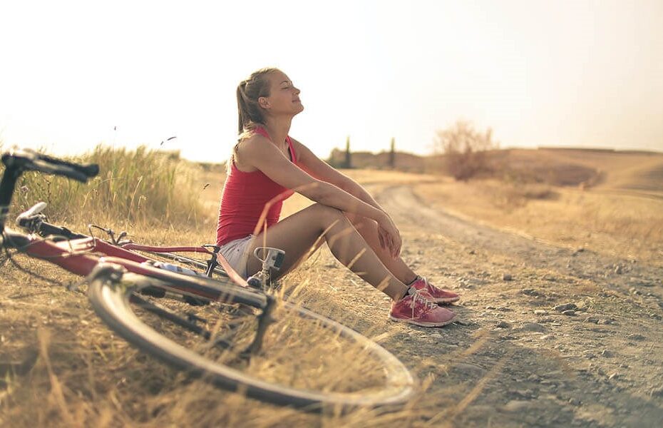 Cyclist enjoying the health benefits of riding through a scenic landscape
