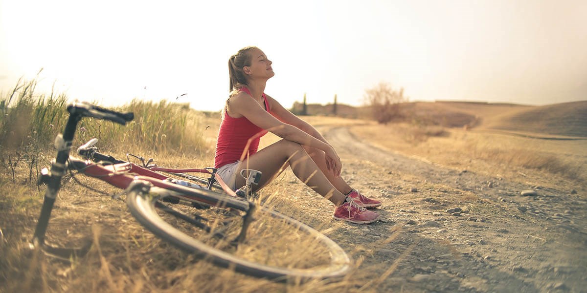 Cyclist enjoying the health benefits of riding through a scenic landscape